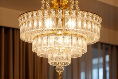 Intricately designed, clean crystal chandelier sparkling brightly
